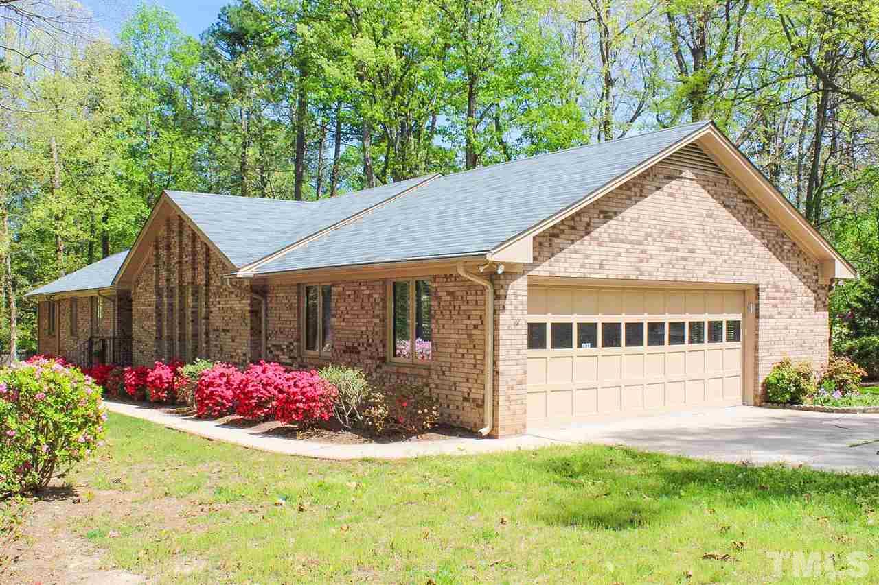9444 Springdale Drive Raleigh, NC 27613 - Photo 1 of 25 a view of a house with a yard