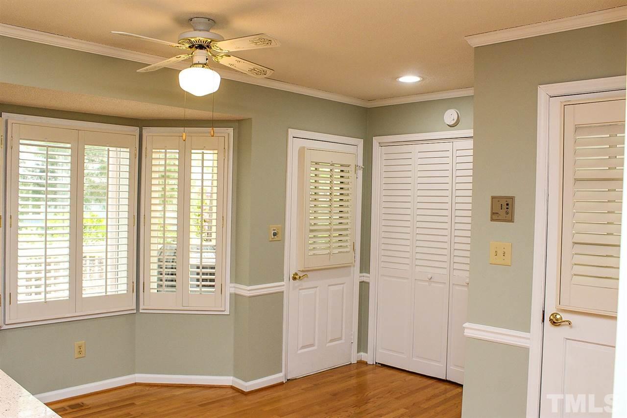 9444 Springdale Drive Raleigh, NC 27613 - Photo 15 of 25 a view of a bedroom with a window and ceiling fan