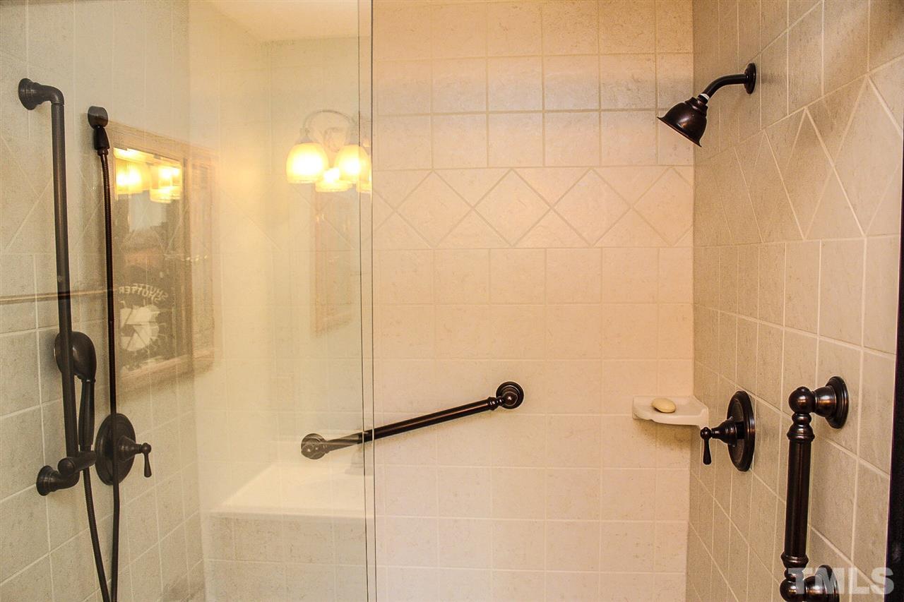 9444 Springdale Drive Raleigh, NC 27613 - Photo 6 of 25 a bathroom with a shower