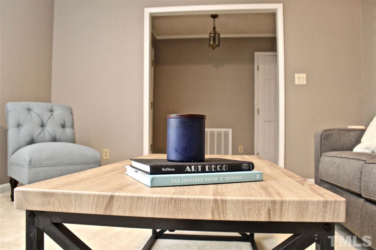 9444 Springdale Drive Raleigh, NC 27613 - Photo 7 of 25 a living room with a couch