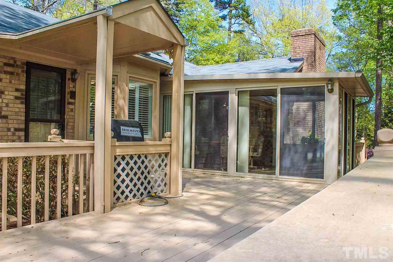 9444 Springdale Drive Raleigh, NC 27613 - Photo 8 of 25 a front view of a house with a porch