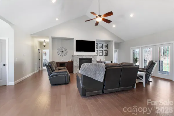 a living room with furniture fireplace and a flat screen tv