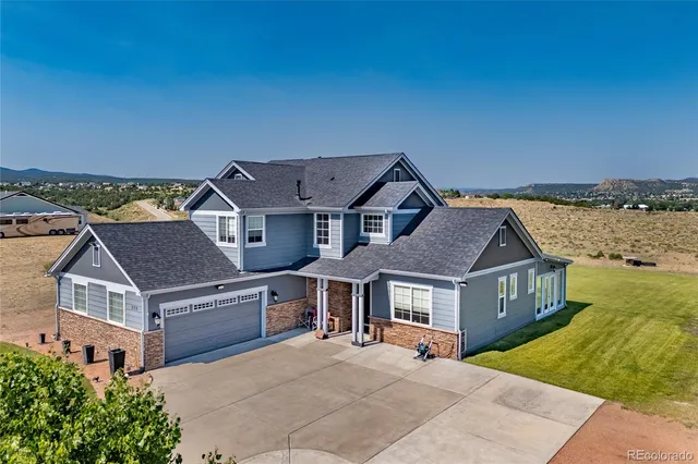 an aerial view of a house with a garden