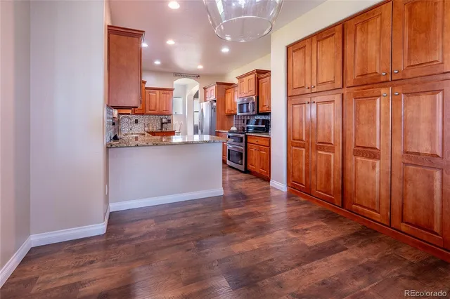 a view of a kitchen with wooden floor