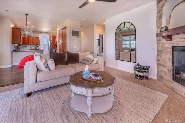 a living room with furniture and a fireplace