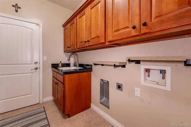 a view of a storage & utility room with two washing machine