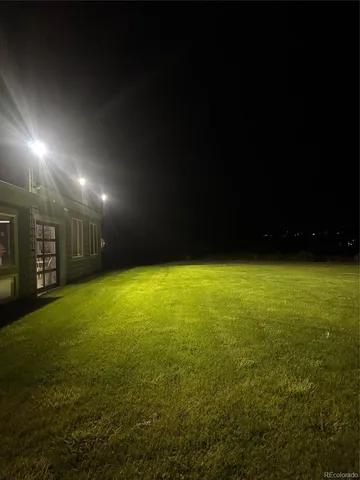 a view of an empty room with kitchen