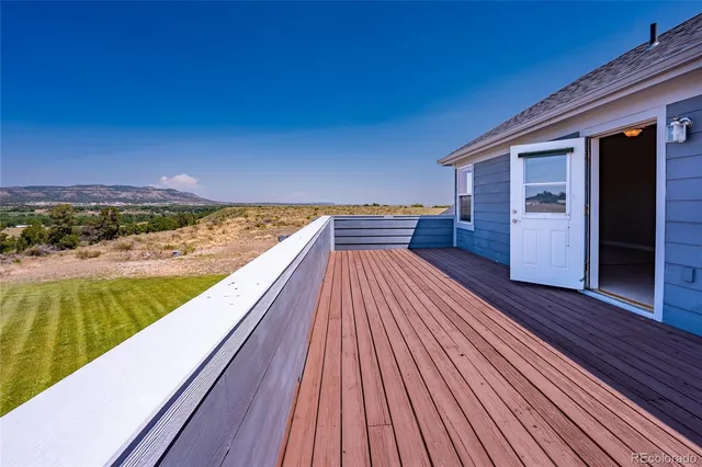 a view of balcony with wooden floor and outdoor space