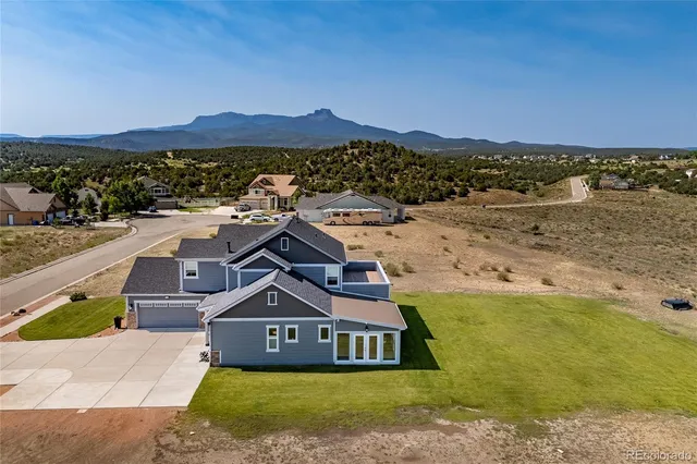 a aerial view of a house with a big yard
