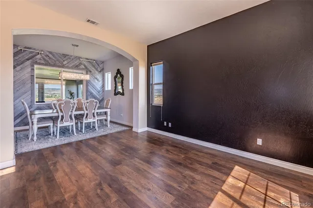 a livingroom with furniture and wooden floor