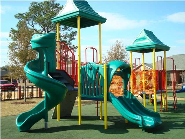 5256 Moore Loop Crestview, FL 32536 - Photo 3 of 4 a childrens park with lots of swings and slides