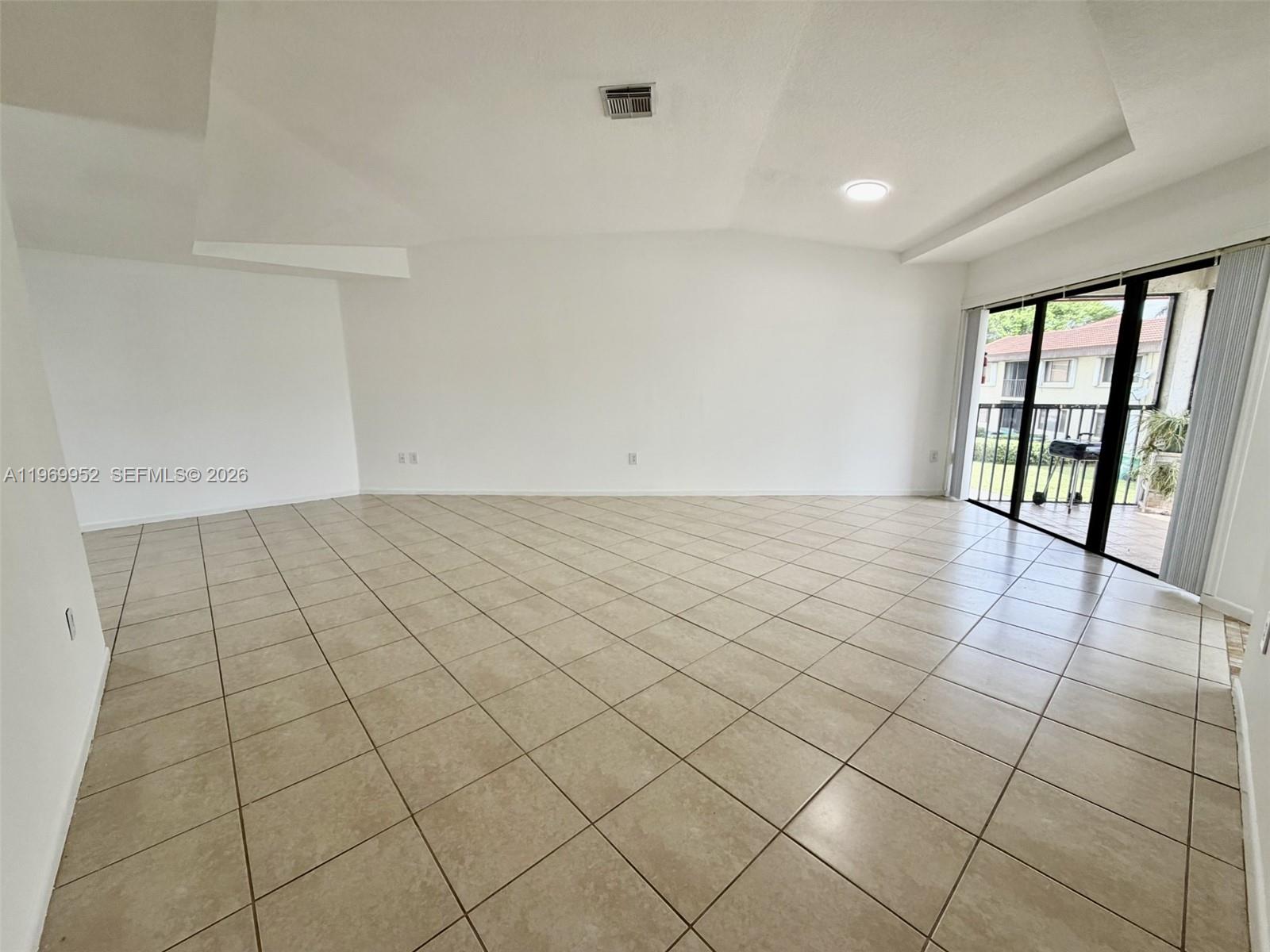 9658 Southwest 138th Avenue, Unit 9658 Miami, FL 33186 - Photo 4 of 20 Living Dining Area