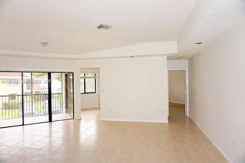 a view of an empty room with a window