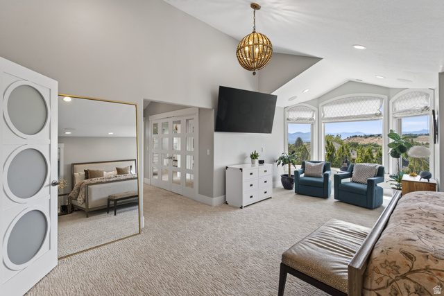 12308 Mariah Circle Draper, UT 84020 - Photo 62 of 293 Expansive room featuring vaulted ceilings, a decorative spherical chandelier, and panoramic windows with landscape scenery
