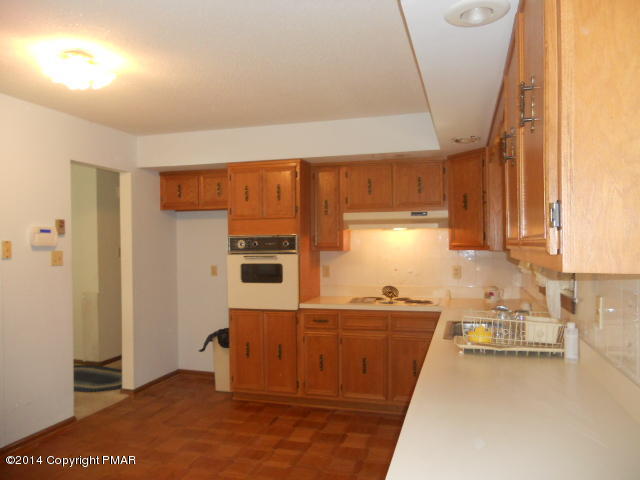 3 Edgewood Road Mount Pocono, PA 18344 - Photo 5 of 23 a kitchen with a sink a stove and cabinets