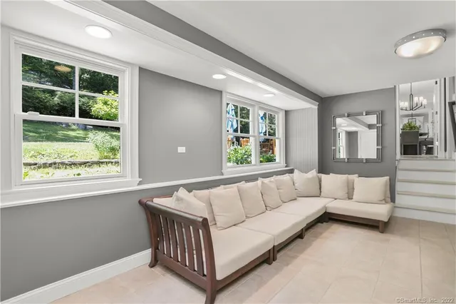 a living room with furniture and windows