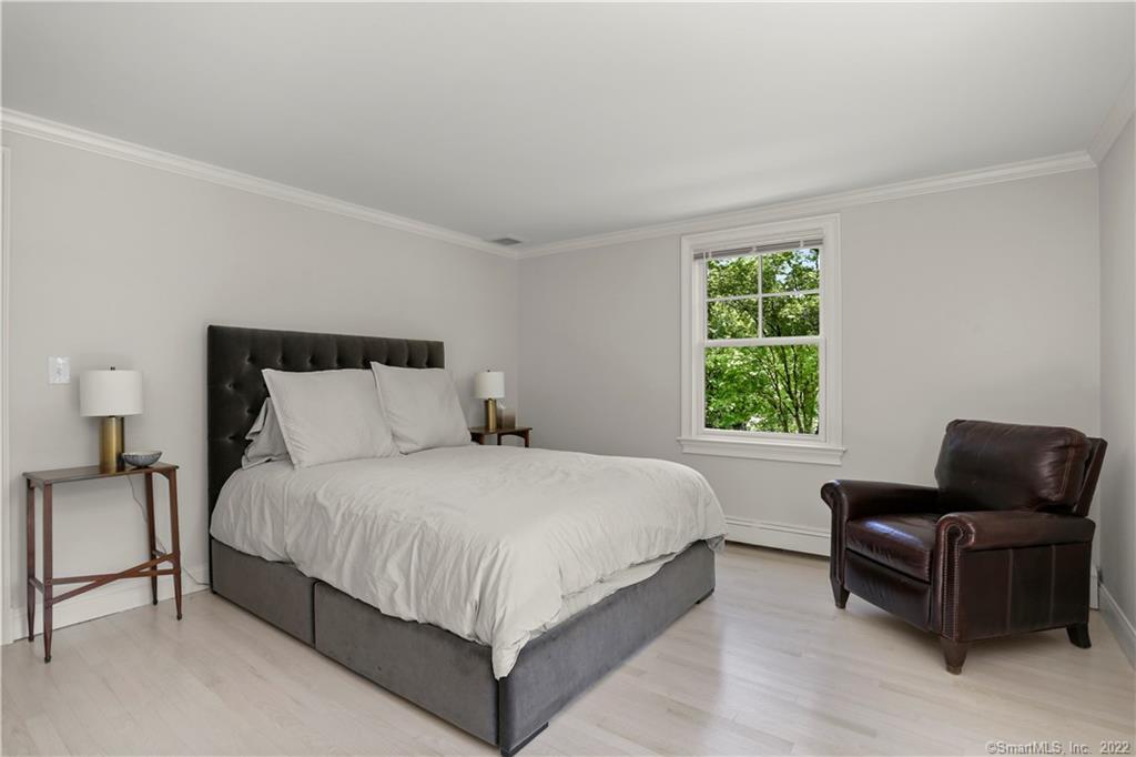220 Burr Street Fairfield, CT 06824 - Photo 20 of 34 a bedroom with bed and window