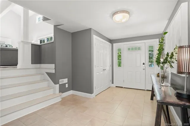 a view of a livingroom with furniture and a potted plant