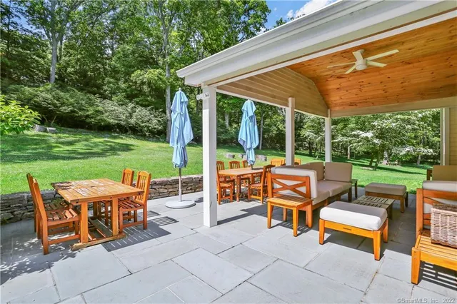a view of a patio with chairs and a table