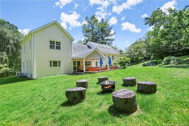 a view of an house with backyard space and garden
