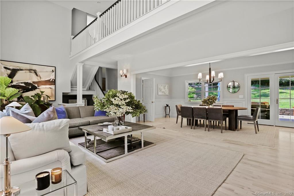 220 Burr Street Fairfield, CT 06824 - Photo 5 of 34 a living room with furniture and a potted plant