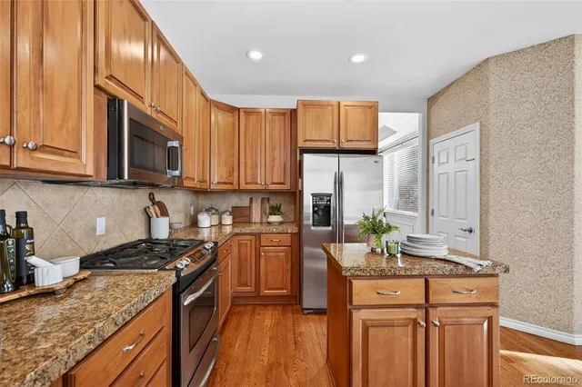 a bathroom with a sink toilet and mirror