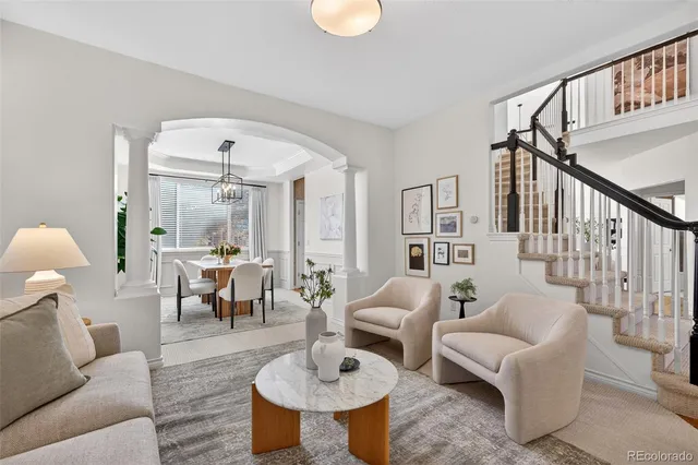 a spacious bedroom with a bed a window and a television