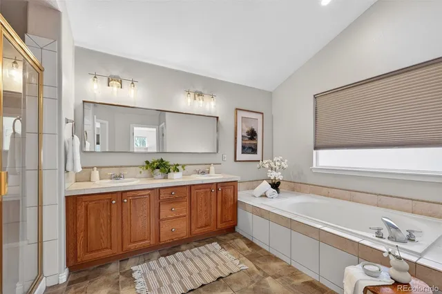 a bathroom with a granite countertop sink a toilet and a mirror
