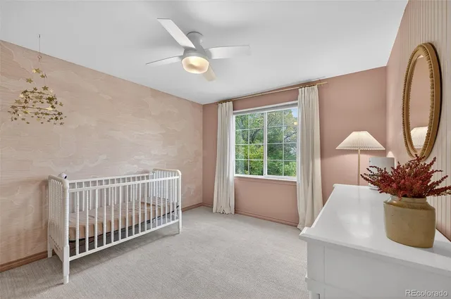 a view of a patio with table and chairs potted plants with wooden floor and fence