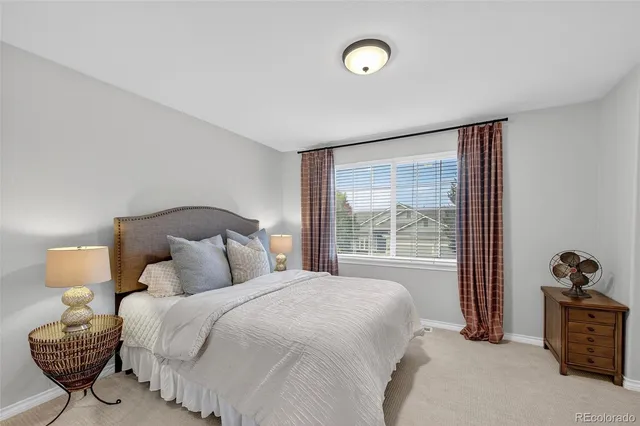 a front view of a house with a yard table and chairs
