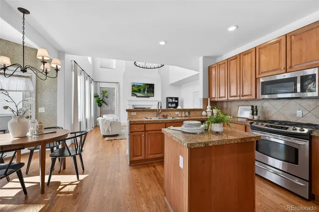 a living room with furniture potted plant and a window