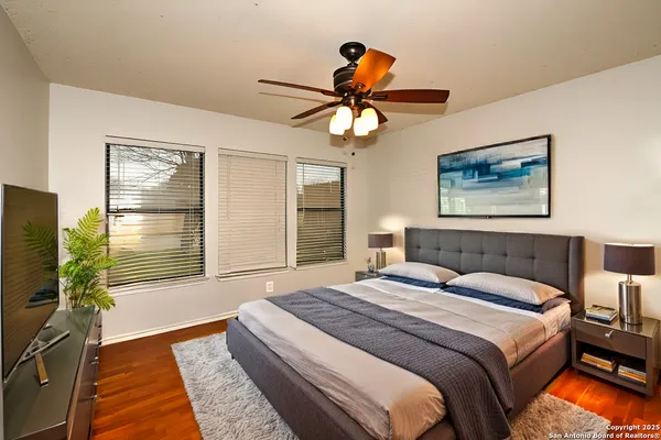 a bedroom with a bed dresser and a window