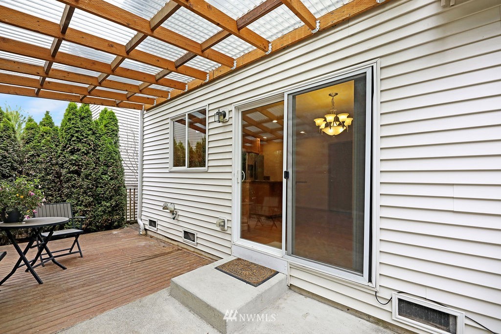 2516 194th Street Southeast Bothell, WA 98012 - Photo 15 of 28 a view of a porch with a table and chairs and a barbeque