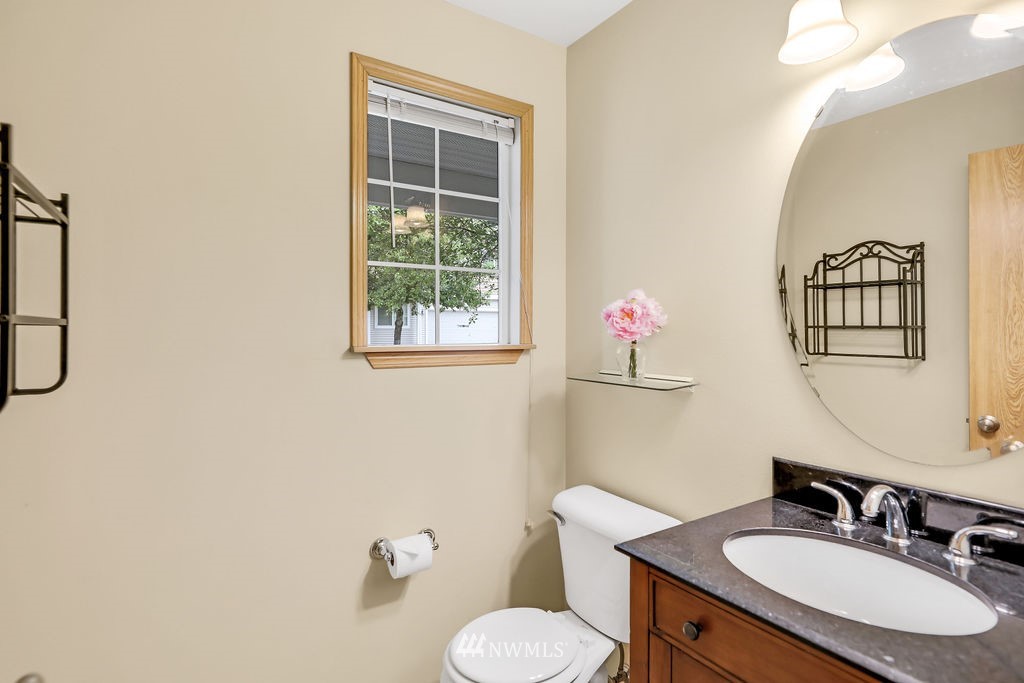 2516 194th Street Southeast Bothell, WA 98012 - Photo 18 of 28 a bathroom with a granite countertop sink mirror and toilet