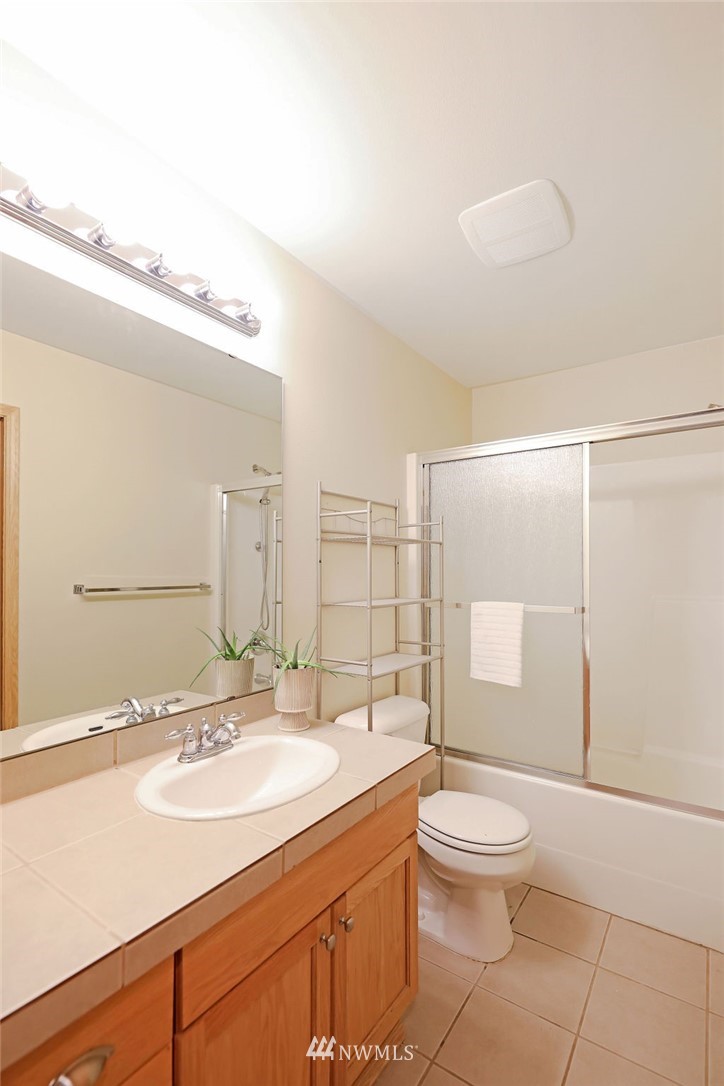 2516 194th Street Southeast Bothell, WA 98012 - Photo 23 of 28 a bathroom with a sink a toilet and shower