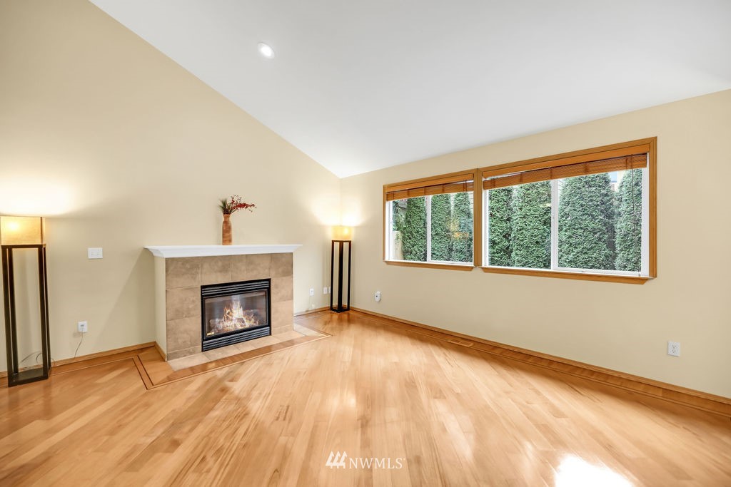 2516 194th Street Southeast Bothell, WA 98012 - Photo 7 of 28 a view of an empty room with a window and a fireplace
