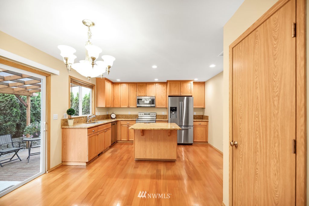 2516 194th Street Southeast Bothell, WA 98012 - Photo 10 of 28 a large kitchen with a table and chairs in it