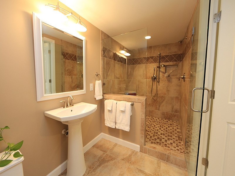 6552 Keystone Drive Raleigh, NC 27612 - Photo 17 of 25 Stunning! Very Nice Lower Level Bathroom with HUGE Tile Shower with Bench, Tile Floors and Pedestal Sink. Bathroom