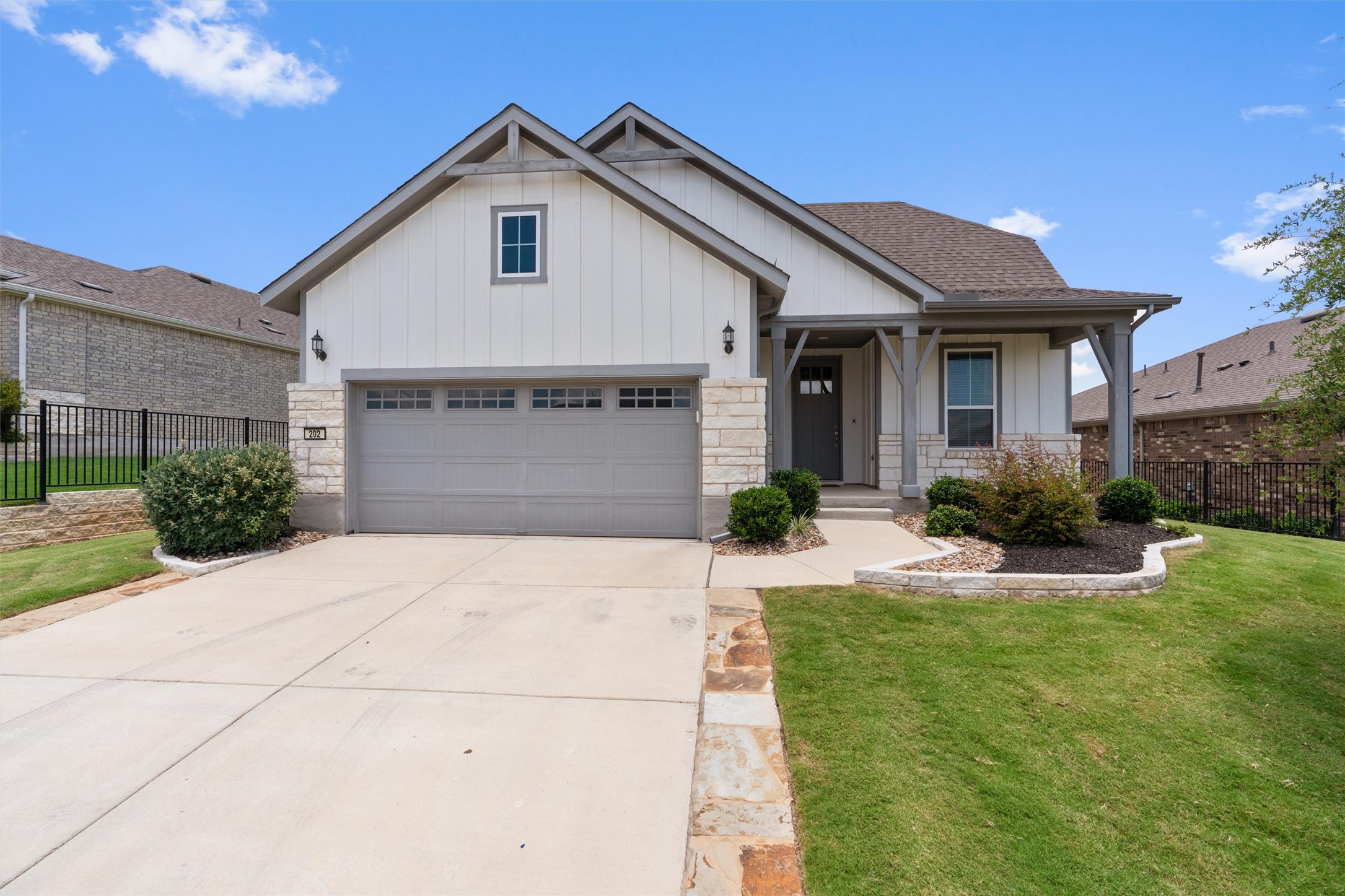 202 Spanish Star Street Georgetown, TX 78633 - Photo 2 of 32 a front view of a house with a yard