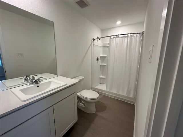 a view of a backyard with hardwood