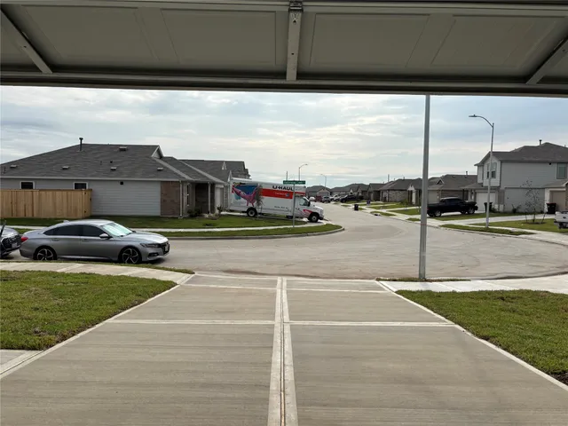 a view of swimming pool with lawn chairs