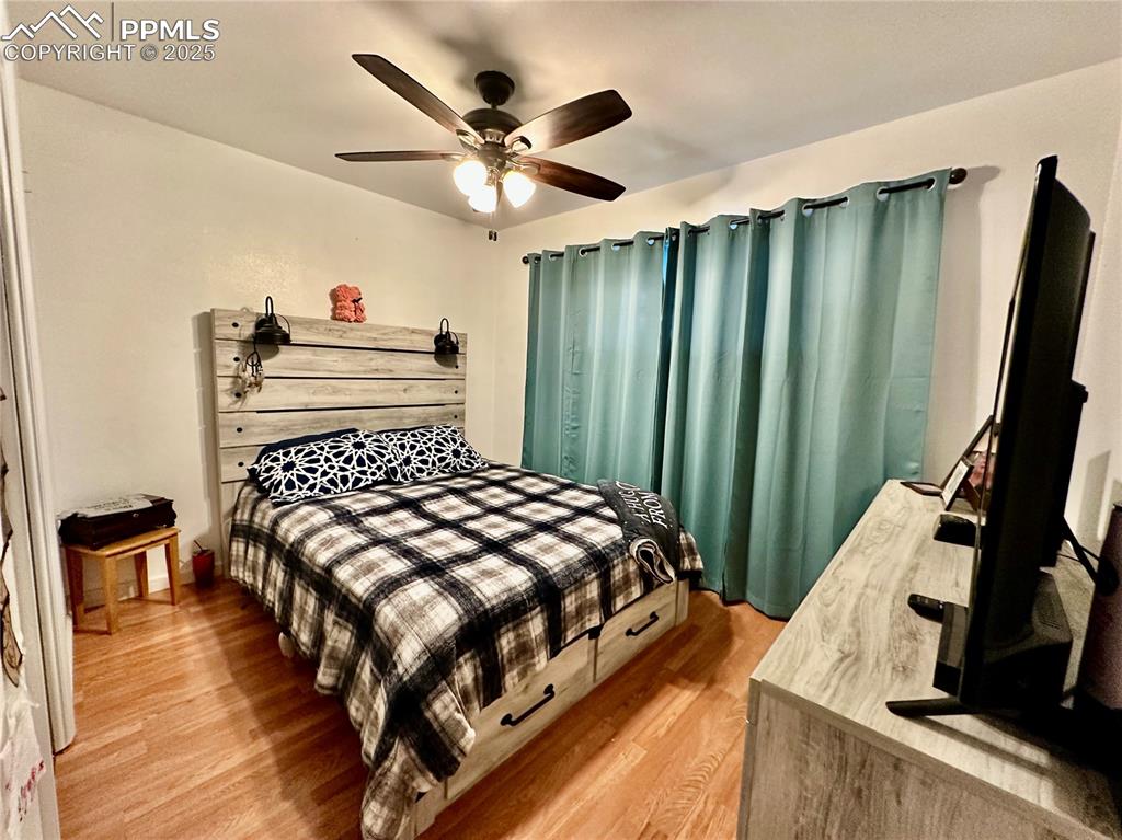 1701 Jerry Murphy Road Pueblo, CO 81001 - Photo 11 of 20 Bedroom with light wood-style floors and a ceiling fan