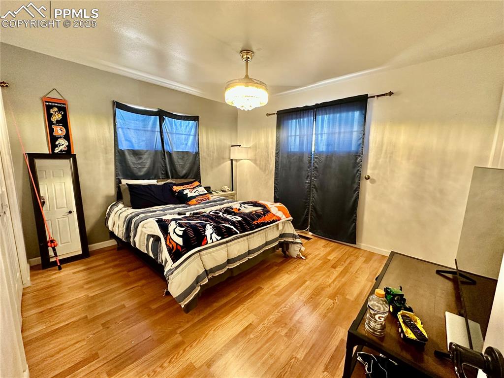1701 Jerry Murphy Road Pueblo, CO 81001 - Photo 13 of 20 Bedroom featuring light wood-style floors