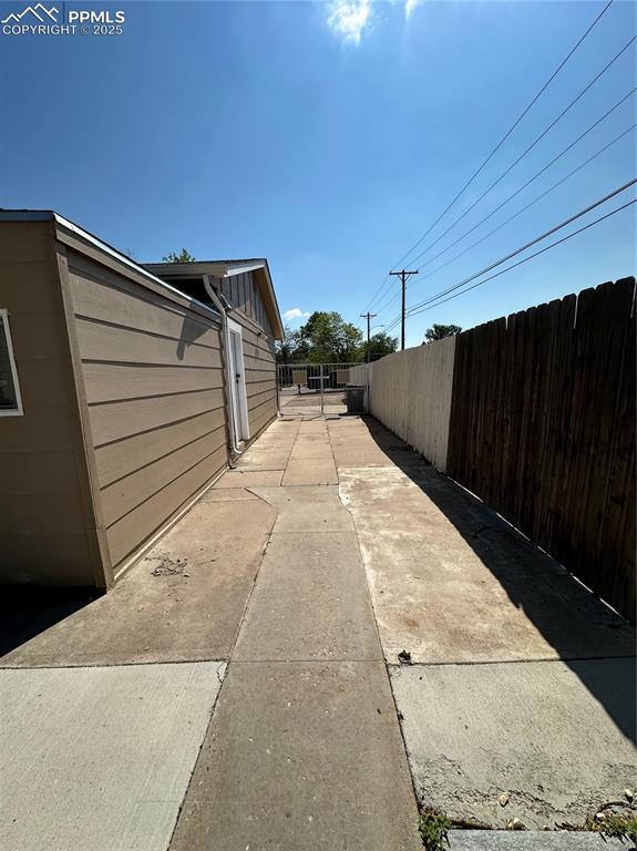 1701 Jerry Murphy Road Pueblo, CO 81001 - Photo 17 of 20 View of side of property with fence