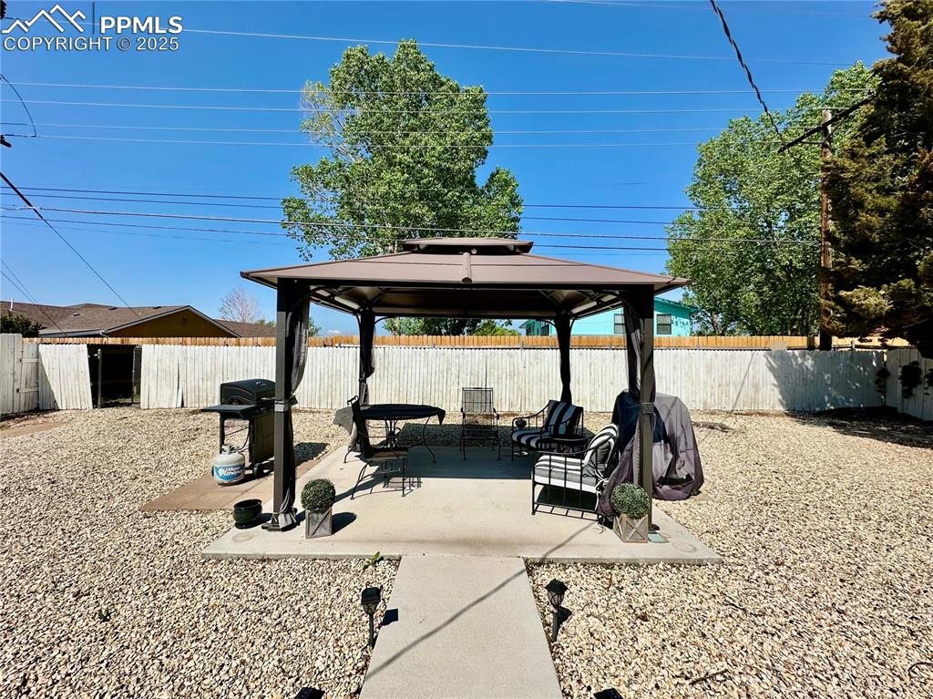 1701 Jerry Murphy Road Pueblo, CO 81001 - Photo 20 of 20 View of patio with a gazebo, a fenced backyard, and area for grilling