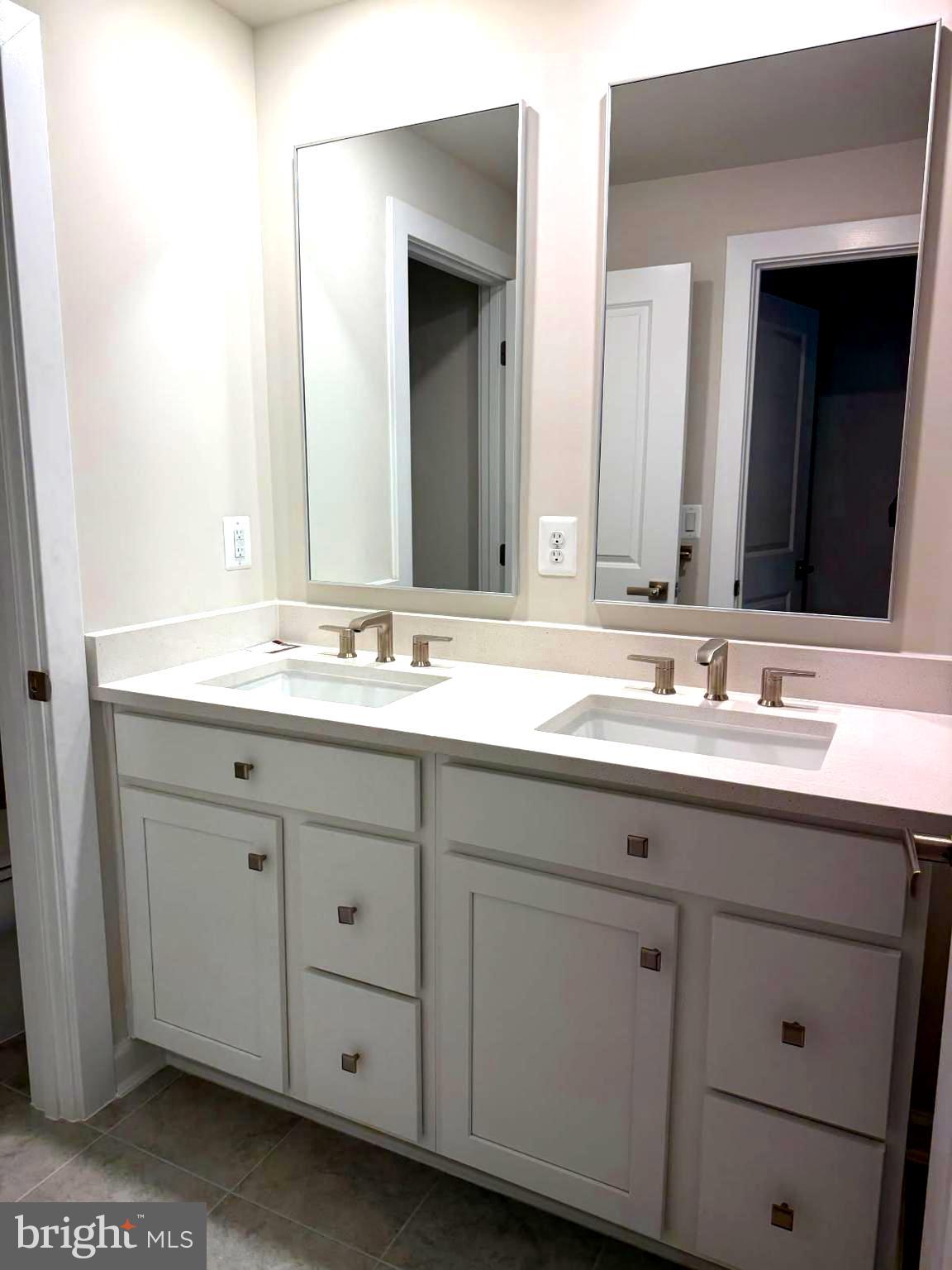 21789 Express Terrace Ashburn, VA 20147 - Photo 15 of 36 a bathroom with a sink and a mirror