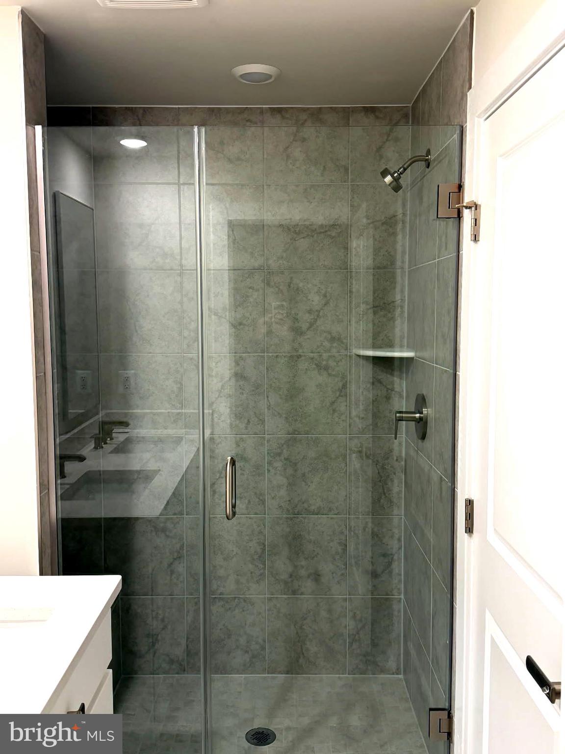 21789 Express Terrace Ashburn, VA 20147 - Photo 18 of 36 a bathroom with a shower and a sink