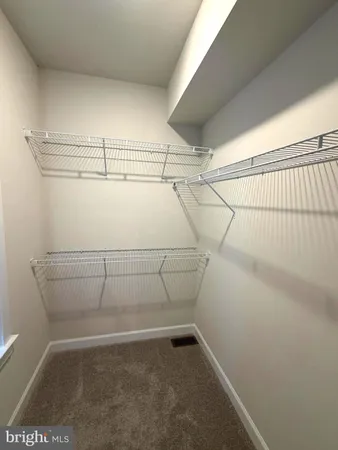 a view of a room with racks on the wall