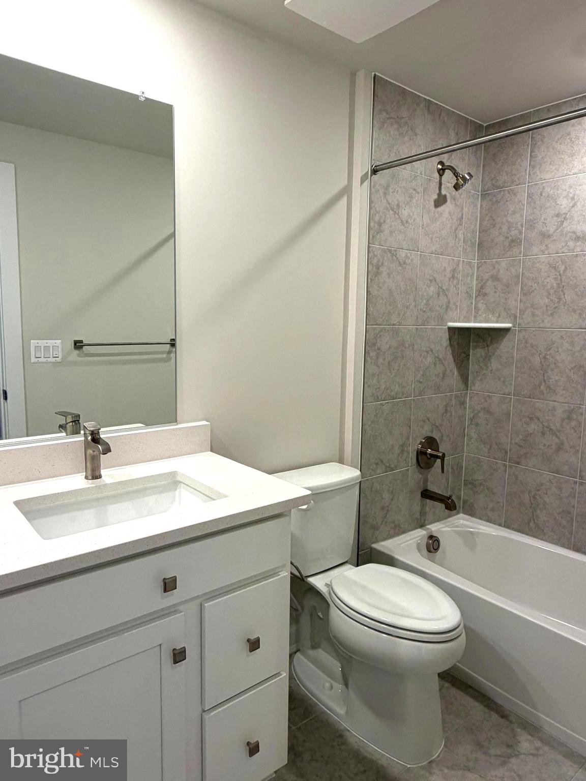 21789 Express Terrace Ashburn, VA 20147 - Photo 20 of 36 a bathroom with a sink a toilet and shower