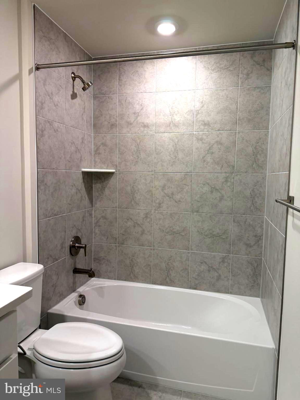 21789 Express Terrace Ashburn, VA 20147 - Photo 22 of 36 a bathroom with a bathtub toilet and shower